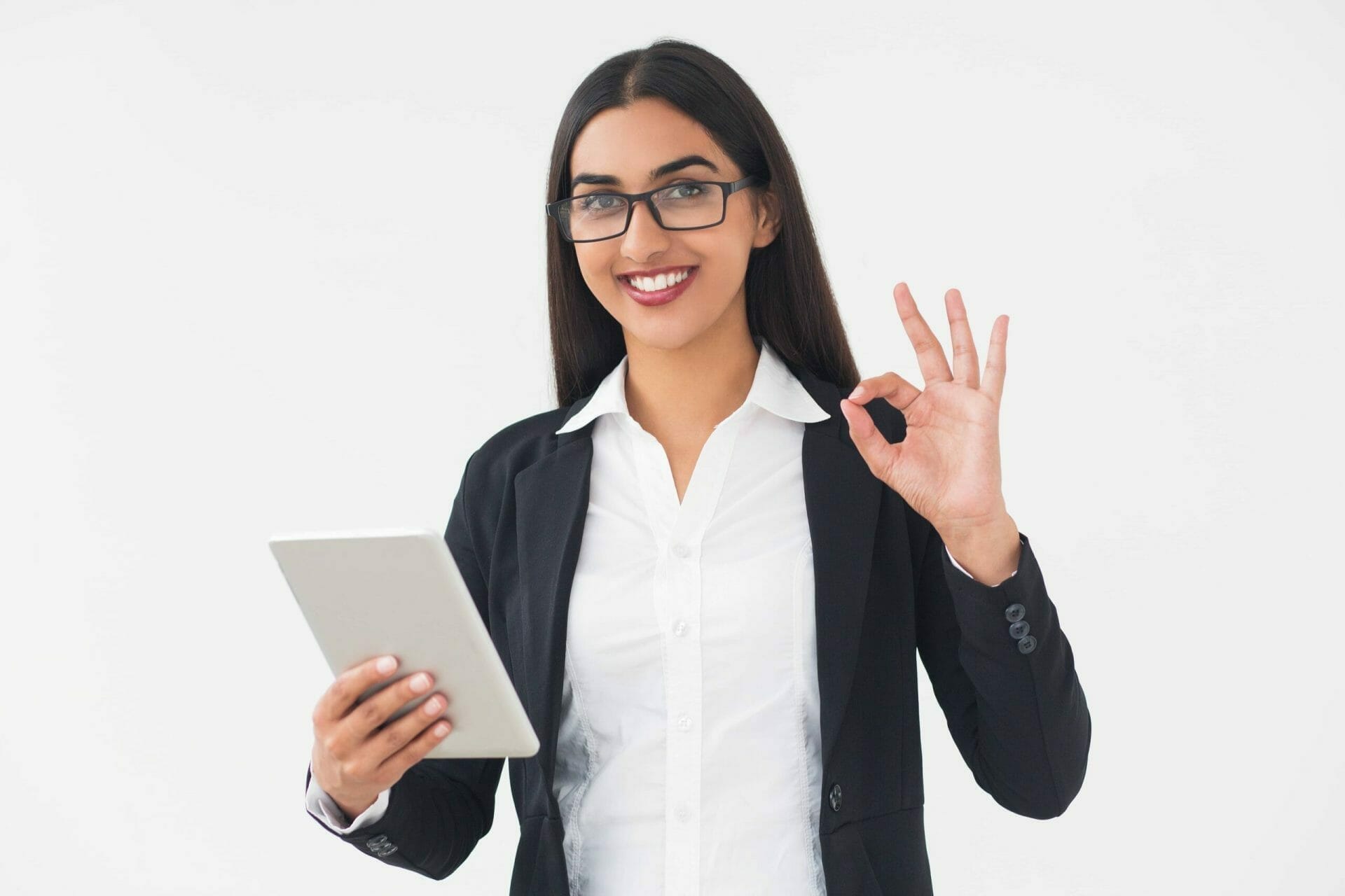 smiling elegant woman with tablet showing ok sign scaled