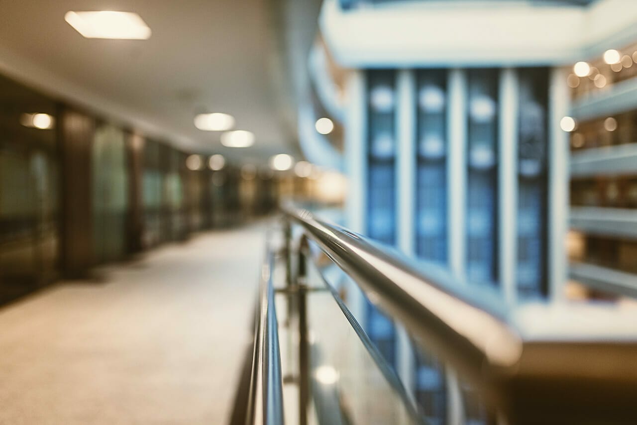 Blurred corridor with glass railing